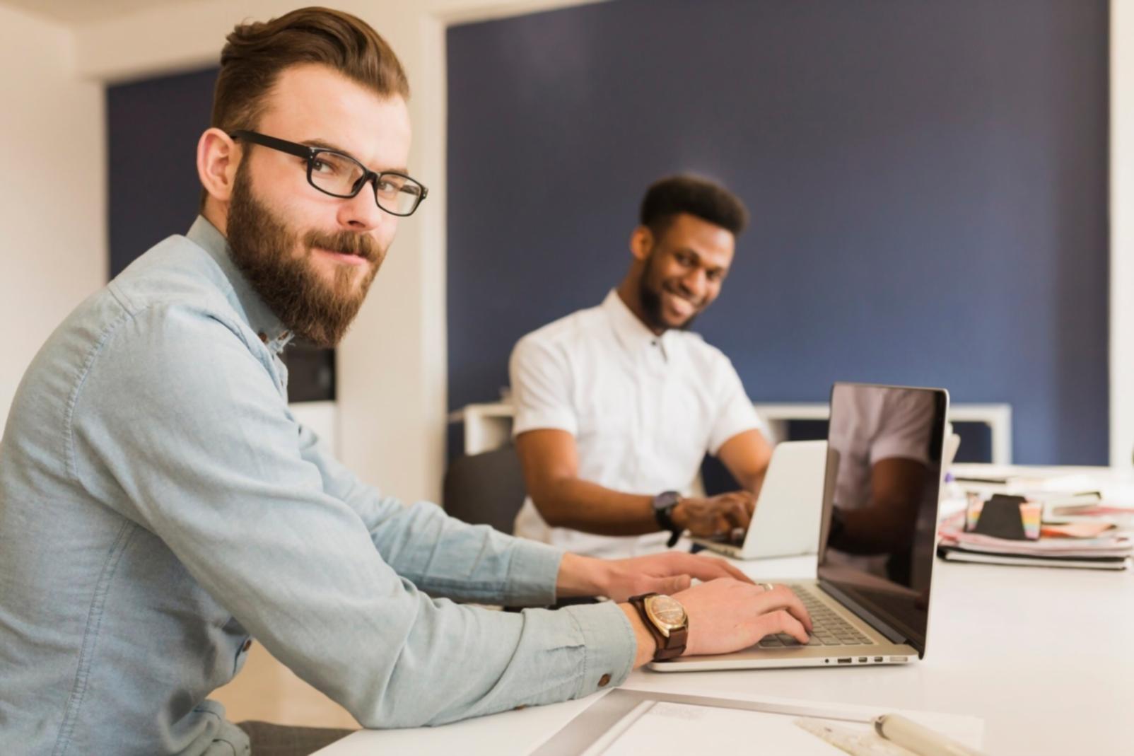 UX design learning materials and portfolio examples spread across a workspace